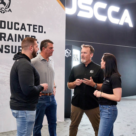 A group of people standing and talking